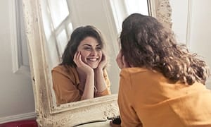 Saying positive self-talk in the mirror is powerful
