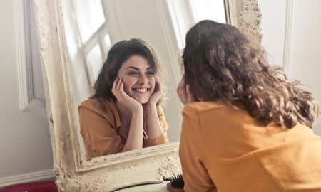 Saying positive self-talk in the mirror is powerful